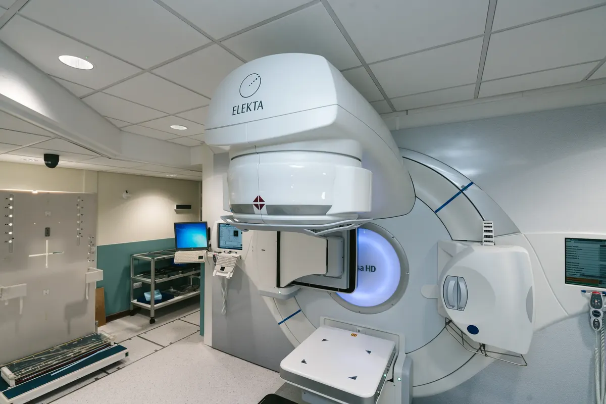 High-tech radiotherapy machine in a hospital setting, essential for cancer treatment.